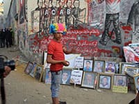 Ronnie Close, Street protest against President Morsi, Tahrir Sq Nov 2012. (wigs and masks are popular).
